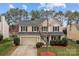 Charming two-story home featuring a two-car garage, manicured lawn, and classic architectural details at 8932 Raven Park Dr, Charlotte, NC 28216