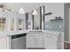 Charming kitchen with white cabinets, pendant lighting, and stainless-steel appliances, combining style and functionality for modern living at 8932 Raven Park Dr, Charlotte, NC 28216