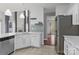 Bright kitchen featuring white cabinets, stainless steel appliances, and a decorative backsplash at 8932 Raven Park Dr, Charlotte, NC 28216