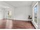 Inviting living room with hardwood floors, bright natural light, and a small side table at 8932 Raven Park Dr, Charlotte, NC 28216