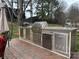 View of outdoor kitchen, featuring stainless steel appliances and plenty of prep space for outdoor cooking at 8932 Raven Park Dr, Charlotte, NC 28216