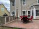 A beautiful outdoor kitchen featuring a grill and bar with plenty of space for entertaining and relaxing at 8932 Raven Park Dr, Charlotte, NC 28216