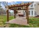 Charming patio features a pergola with outdoor seating, a grill, and a ceiling fan for comfortable outdoor living at 8932 Raven Park Dr, Charlotte, NC 28216