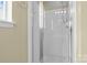 Bathroom featuring an enclosed tiled shower and neutral walls at 8932 Raven Park Dr, Charlotte, NC 28216