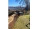 Backyard with fire pit and room to entertain in a secluded, wooded area at 920 Oakridge Farm Hwy, Mooresville, NC 28115