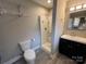 Modern bathroom featuring a walk-in shower, sleek vanity, and contemporary fixtures at 920 Oakridge Farm Hwy, Mooresville, NC 28115