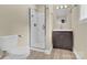 Bathroom featuring a glass shower, vanity, and toilet at 920 Oakridge Farm Hwy, Mooresville, NC 28115
