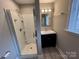 Clean bathroom with shower, modern vanity, updated fixtures and plenty of natural light at 920 Oakridge Farm Hwy, Mooresville, NC 28115