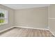 Cozy bedroom featuring neutral walls and hardwood floors at 920 Oakridge Farm Hwy, Mooresville, NC 28115