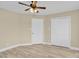 Bedroom with ceiling fan and two closets at 920 Oakridge Farm Hwy, Mooresville, NC 28115