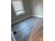 This cozy bedroom features neutral paint, wood floors, and a window at 920 Oakridge Farm Hwy, Mooresville, NC 28115