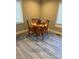 Charming dining area featuring hardwood floors, bright light, and a modern coffeemaker at 920 Oakridge Farm Hwy, Mooresville, NC 28115