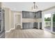 Open kitchen area with gray cabinets, plenty of counter space, and sliding door access to the backyard at 920 Oakridge Farm Hwy, Mooresville, NC 28115