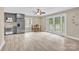 Open kitchen with a dining area featuring stainless steel appliances and a large window at 920 Oakridge Farm Hwy, Mooresville, NC 28115