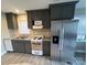 Bright kitchen with stainless steel appliances, granite countertops, and ample cabinet space at 920 Oakridge Farm Hwy, Mooresville, NC 28115