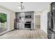 Charming kitchen featuring gray cabinetry, modern stainless steel appliances, and mosaic tile backsplash at 920 Oakridge Farm Hwy, Mooresville, NC 28115