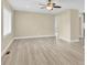An open living room with light-colored walls, new flooring, white trim, and bright natural light from the window at 920 Oakridge Farm Hwy, Mooresville, NC 28115