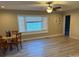 Spacious living room featuring a dining table, hardwood floors, a ceiling fan, and natural light at 920 Oakridge Farm Hwy, Mooresville, NC 28115
