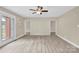 Bright living room with double doors, neutral walls, and modern lighting fixtures at 920 Oakridge Farm Hwy, Mooresville, NC 28115