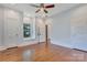 Open and airy bedroom boasting natural light and classic hardwood flooring at 1006 N Ridge Ave, Kannapolis, NC 28083