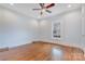 Bright bedroom features hardwood floors and a modern ceiling fan at 1006 N Ridge Ave, Kannapolis, NC 28083