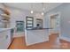 Updated kitchen showcasing a cooktop island, stainless steel oven and a large refrigerator at 1006 N Ridge Ave, Kannapolis, NC 28083