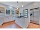 Modern kitchen featuring an island cooktop, stainless appliances, and white cabinetry at 1006 N Ridge Ave, Kannapolis, NC 28083