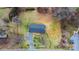 Aerial view of a single-Gathering home with a metal roof, surrounded by lush greenery and a private driveway at 104 Pop Davis Rd, Taylorsville, NC 28681
