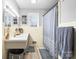 Well-maintained bathroom with neutral color scheme and walk-in shower with a curtain at 104 Pop Davis Rd, Taylorsville, NC 28681