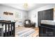 Charming Bedroom features wood-look flooring, a gray chair, and a dark closet at 104 Pop Davis Rd, Taylorsville, NC 28681