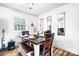 Bright dining room features wood floors, white walls, and decorative mirrors at 104 Pop Davis Rd, Taylorsville, NC 28681