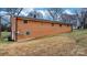 A brick home features a well-maintained lawn and a clean back facade at 104 Pop Davis Rd, Taylorsville, NC 28681