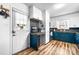 Well-lit kitchen includes a cozy workstation, sleek stainless steel appliances, and stylish wood floors at 104 Pop Davis Rd, Taylorsville, NC 28681