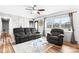 Comfortable living room featuring wood floors and a stylish sofa set, creating an inviting atmosphere at 104 Pop Davis Rd, Taylorsville, NC 28681