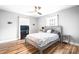 Neutral bedroom features hardwood floors, a ceiling fan, and plenty of natural light at 104 Pop Davis Rd, Taylorsville, NC 28681