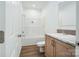 Bathroom with white cabinets, modern sink, and a shower-tub combination at 108 Sarah Ave, Newton, NC 28658