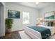 Cozy bedroom with a large window, bed with decorative pillows, and two framed prints at 108 Sarah Ave, Newton, NC 28658