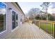 Spacious wooden deck with black railing, offering an outdoor entertaining space at 108 Sarah Ave, Newton, NC 28658