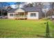 Charming home featuring a spacious front yard and welcoming entrance with wooden porch at 108 Sarah Ave, Newton, NC 28658
