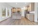 Spacious kitchen with light wood cabinets, stainless appliances, and a center island with seating at 108 Sarah Ave, Newton, NC 28658
