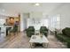 Inviting living room with stylish decor, hardwood floors, and a seamless flow to the kitchen at 108 Sarah Ave, Newton, NC 28658