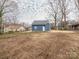 A blue home with bare backyard, ready for landscaping and outdoor enjoyment at 1137 Williams St, Rock Hill, SC 29732