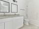 Modern bathroom with double vanity, granite countertops, and a combined shower-tub at 1137 Williams St, Rock Hill, SC 29732