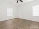 Spacious bedroom with a ceiling fan, a double-hung window, and wood-look flooring at 1137 Williams St, Rock Hill, SC 29732
