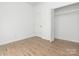 Cozy bedroom with wood-look flooring, closet and neutral walls create a serene atmosphere at 1137 Williams St, Rock Hill, SC 29732