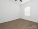 Bright bedroom featuring neutral walls, wood-look flooring, a ceiling fan, and a window with blinds at 1137 Williams St, Rock Hill, SC 29732