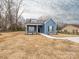Charming blue home with a walkway surrounded by bare yard, awaiting your landscaping ideas at 1137 Williams St, Rock Hill, SC 29732