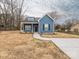 Inviting blue home featuring a well-maintained front yard and classic architectural details at 1137 Williams St, Rock Hill, SC 29732