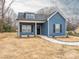 Charming blue home with black shutters, white trim, dormer, and sidewalk to the front door at 1137 Williams St, Rock Hill, SC 29732