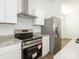 Modern kitchen features granite countertops, stainless steel appliances, and white cabinets at 1137 Williams St, Rock Hill, SC 29732